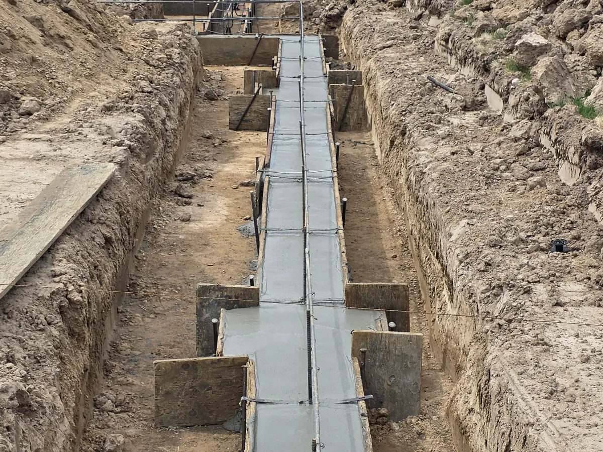 Poured footing with wall steel in place at the Eagle custom home addition, week of September 14, 2026.