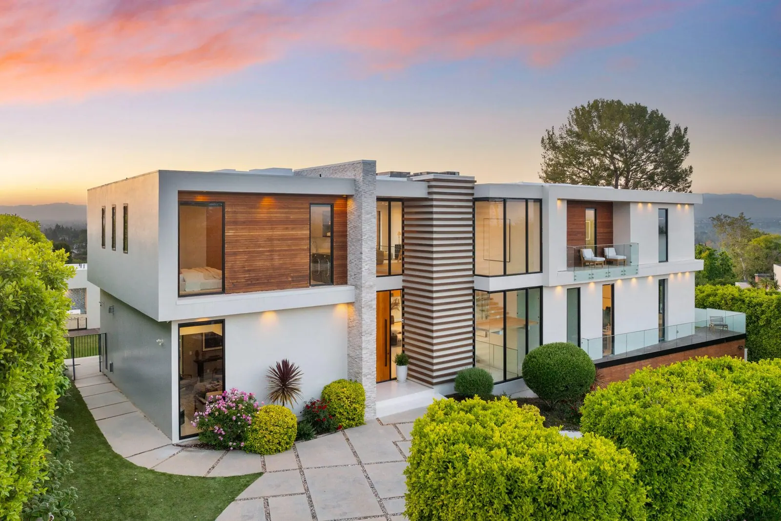 Custom home on a hillside lot with natural terrain