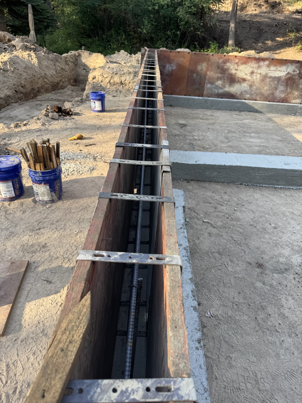 Footing and stem wall form progress for Garden Valley Retreat, week of June 22, 2026.
